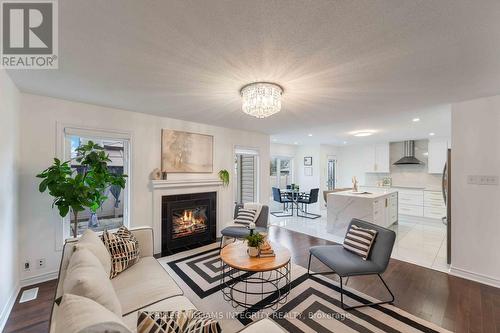 580 Sunlit Circle, Ottawa, ON - Indoor Photo Showing Living Room With Fireplace