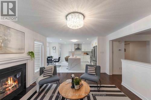 580 Sunlit Circle, Ottawa, ON - Indoor Photo Showing Living Room With Fireplace