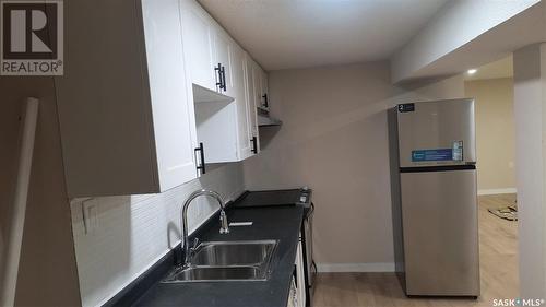 104 Garnet Street, Regina, SK - Indoor Photo Showing Kitchen With Double Sink