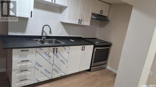 104 Garnet Street, Regina, SK - Indoor Photo Showing Kitchen With Double Sink