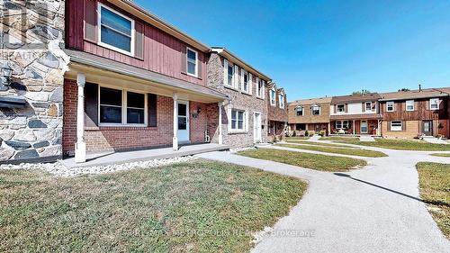 12 - 2051 Bridletowne Circle, Toronto, ON - Outdoor With Facade