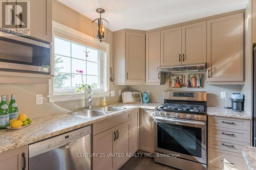 140 - 301 Carnegie Avenue, Peterborough (Northcrest), ON - Indoor Photo Showing Kitchen With Stainless Steel Kitchen With Double Sink