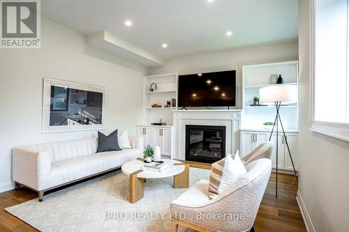 246 O'Connor Drive, Toronto, ON - Indoor Photo Showing Living Room With Fireplace