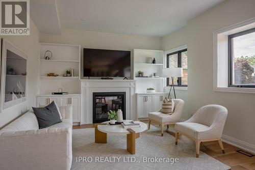 246 O'Connor Drive, Toronto, ON - Indoor Photo Showing Living Room With Fireplace