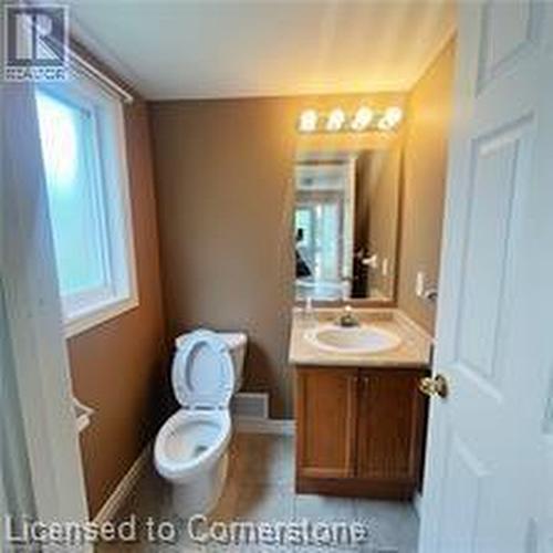 Bathroom with tile patterned flooring, vanity, and toilet - 17 Hawkswood Drive, Kitchener, ON - Indoor Photo Showing Bathroom