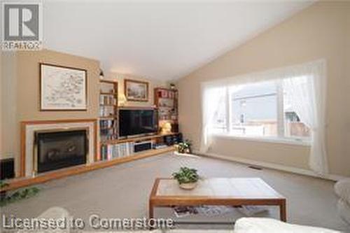 Living room with lofted ceiling - 17 Hawkswood Drive, Kitchener, ON - Indoor Photo Showing Living Room With Fireplace