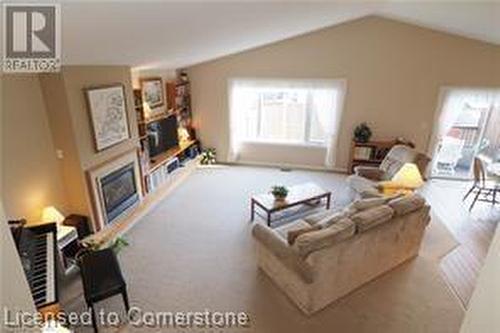 Living room with lofted ceiling - 17 Hawkswood Drive, Kitchener, ON - Indoor Photo Showing Living Room With Fireplace