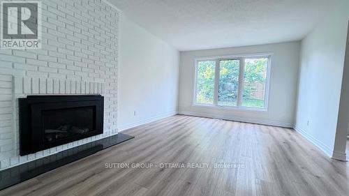 191 - 2111 Montreal Road N, Ottawa, ON - Indoor Photo Showing Living Room With Fireplace