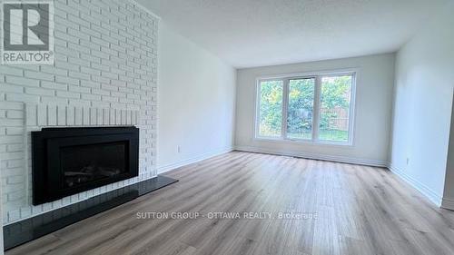 191 - 2111 Montreal Road N, Ottawa, ON - Indoor Photo Showing Living Room With Fireplace