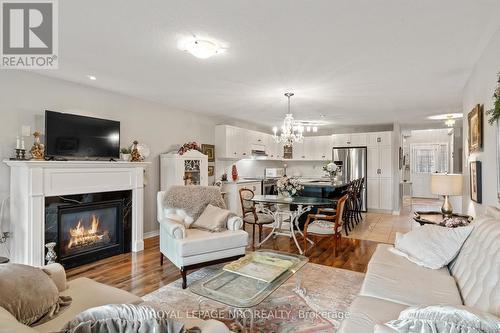 11 - 77 Avery Crescent, St. Catharines, ON - Indoor Photo Showing Living Room With Fireplace