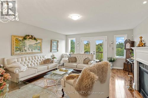 11 - 77 Avery Crescent, St. Catharines, ON - Indoor Photo Showing Living Room With Fireplace