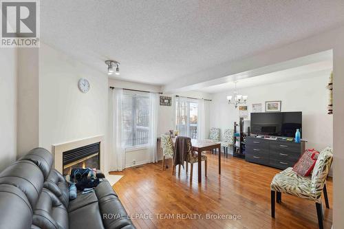 121 Ashpark Crescent, Ottawa, ON - Indoor Photo Showing Living Room With Fireplace