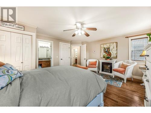 3515 Ridge Boulevard, West Kelowna, BC - Indoor Photo Showing Bedroom With Fireplace