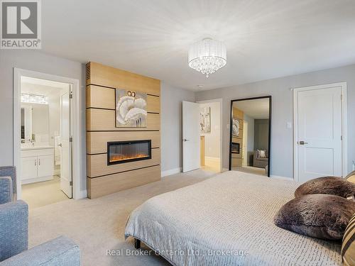 395 Klein Circle, Hamilton (Meadowlands), ON - Indoor Photo Showing Bedroom With Fireplace