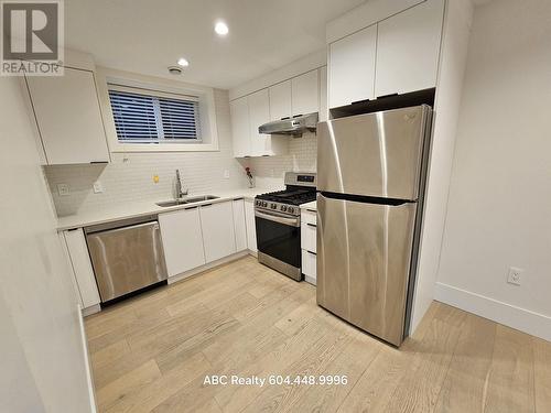 7Xx W 53 Street, Vancouver, BC - Indoor Photo Showing Kitchen With Double Sink