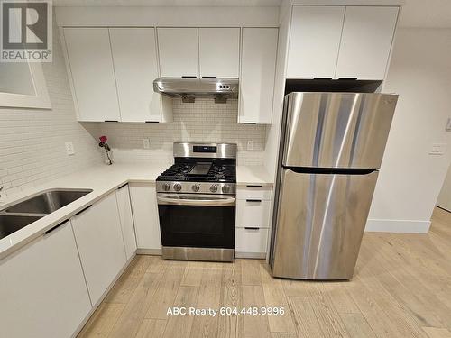 7Xx W 53 Street, Vancouver, BC - Indoor Photo Showing Kitchen With Double Sink