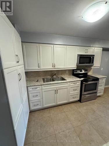 65 - 2170 Bromsgrove Road, Mississauga, ON - Indoor Photo Showing Kitchen With Double Sink