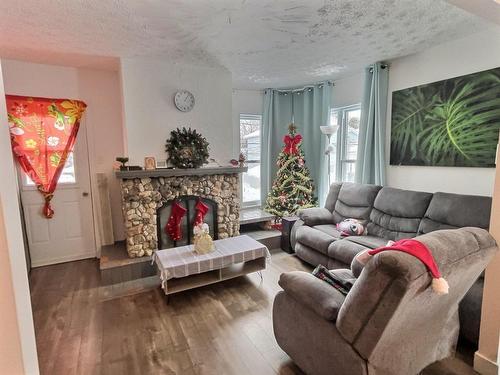 Salon - 197  - 201 Rue Roy, Thetford Mines, QC - Indoor Photo Showing Living Room With Fireplace