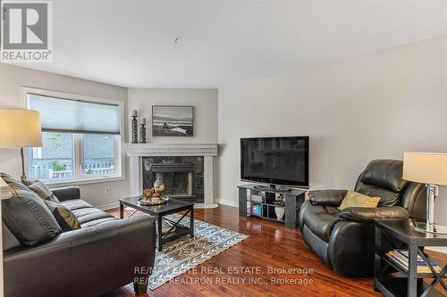 Upper - 115 James Street, Barrie, ON - Indoor Photo Showing Living Room With Fireplace