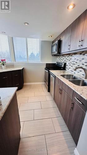 311 - 30 Thunder Grove, Toronto, ON - Indoor Photo Showing Kitchen With Double Sink