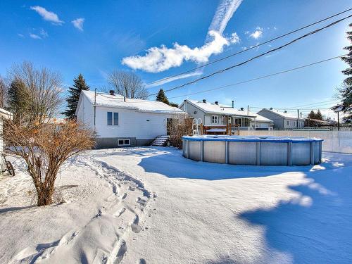 Back facade - 3580 Rue Des Libellules, Terrebonne (La Plaine), QC - Outdoor With Above Ground Pool With Backyard