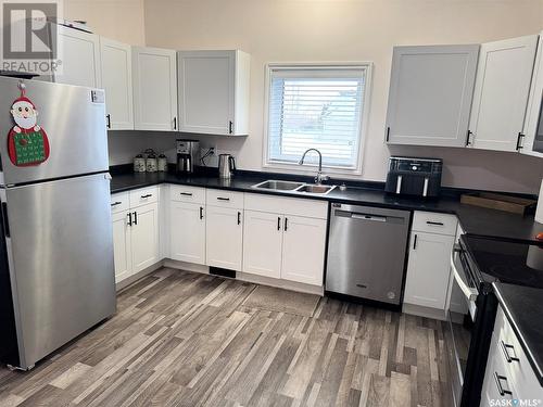 35 Mayo Street, Lanigan, SK - Indoor Photo Showing Kitchen With Stainless Steel Kitchen With Double Sink