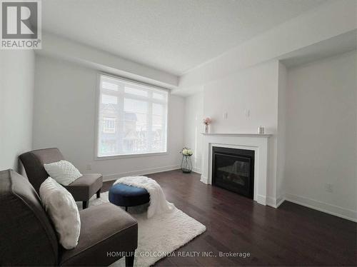 11 Elkington Crescent, Whitby, ON - Indoor Photo Showing Living Room With Fireplace