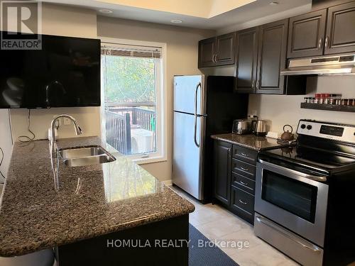 106 - 9589 Keele Street, Vaughan, ON - Indoor Photo Showing Kitchen With Double Sink