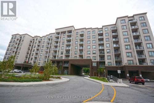 212 - 2486 Old Bronte Road, Oakville, ON - Outdoor With Facade