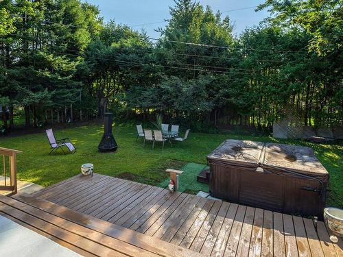 Hot tub - 1219 Rue Des Saules, Prévost, QC - Outdoor With Deck Patio Veranda With Backyard