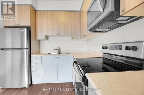 403 - 65 Yorkland Boulevard, Brampton, ON - Indoor Photo Showing Kitchen With Double Sink