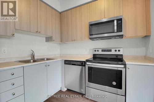 403 - 65 Yorkland Boulevard, Brampton, ON - Indoor Photo Showing Kitchen With Double Sink