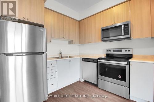 403 - 65 Yorkland Boulevard, Brampton, ON - Indoor Photo Showing Kitchen With Double Sink