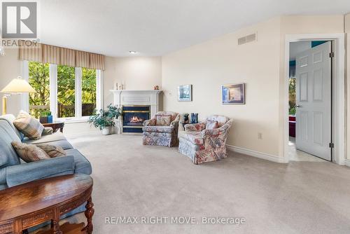 16 - 141 Welland Vale Road, St. Catharines, ON - Indoor Photo Showing Living Room With Fireplace