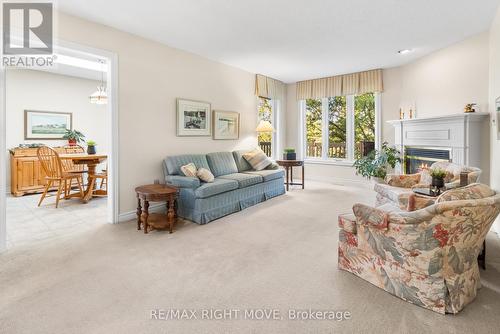 16 - 141 Welland Vale Road, St. Catharines, ON - Indoor Photo Showing Living Room With Fireplace