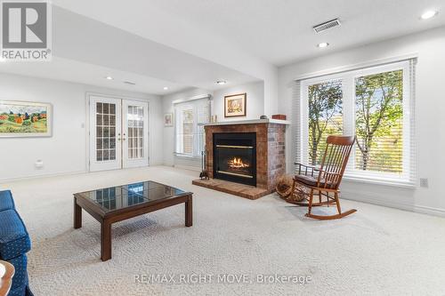 16 - 141 Welland Vale Road, St. Catharines, ON - Indoor Photo Showing Living Room With Fireplace