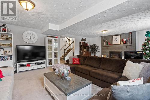 203 Gadsby Avenue, Welland (767 - N. Welland), ON - Indoor Photo Showing Living Room With Fireplace