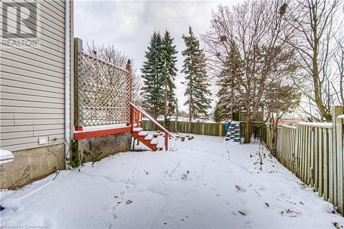 Yard covered in snow with a playground - 21 Woodborough Place, Cambridge, ON - Outdoor