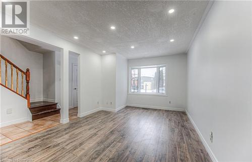 Spare room featuring a textured ceiling and hardwood / wood-style flooring - 21 Woodborough Place, Cambridge, ON - Indoor Photo Showing Other Room