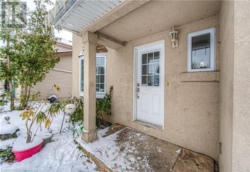 View of snow covered property entrance - 21 Woodborough Place, Cambridge, ON - Outdoor With Exterior