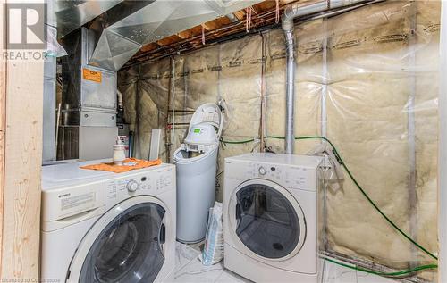 Laundry area with washer and dryer and heating unit - 21 Woodborough Place, Cambridge, ON - Indoor Photo Showing Laundry Room