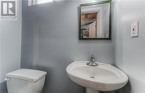 Bathroom featuring toilet and sink - 21 Woodborough Place, Cambridge, ON - Indoor Photo Showing Bathroom