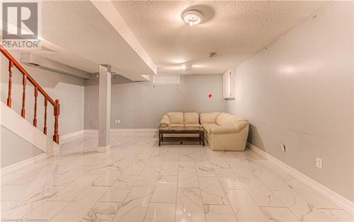 Unfurnished living room featuring a textured ceiling - 21 Woodborough Place, Cambridge, ON - Indoor Photo Showing Other Room