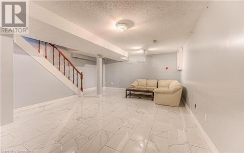 Basement featuring a textured ceiling - 21 Woodborough Place, Cambridge, ON - Indoor Photo Showing Other Room