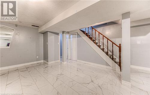 Basement featuring a textured ceiling - 21 Woodborough Place, Cambridge, ON - Indoor Photo Showing Other Room