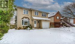 View of front of property with a garage - 