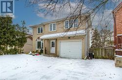 View of front of property with a garage - 