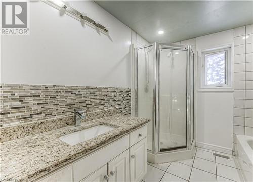 Bathroom with tile patterned flooring, vanity, and an enclosed shower - 21 Woodborough Place, Cambridge, ON - Indoor Photo Showing Bathroom