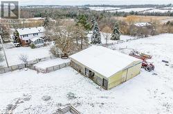 Snowy aerial view featuring a rural view - 