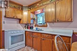 Kitchen featuring electric stove and sink - 